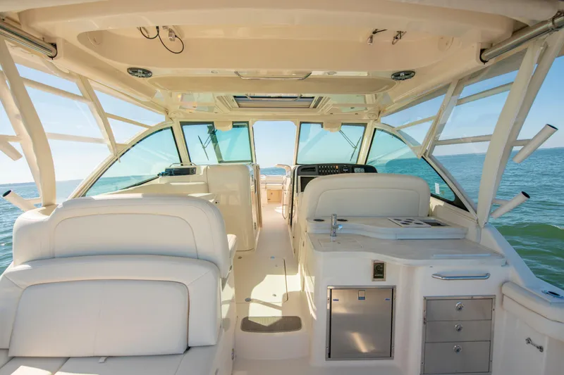 Slide: The Image of 2019 Grady-White Freedom 375 boat interior with luxurious seating and ocean view. - 20