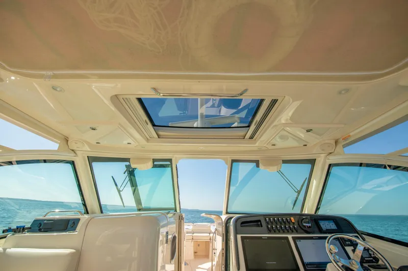 Slide: The Image of Interior view of 2019 Grady-White Freedom 375 boat cockpit with ocean backdrop. - 25