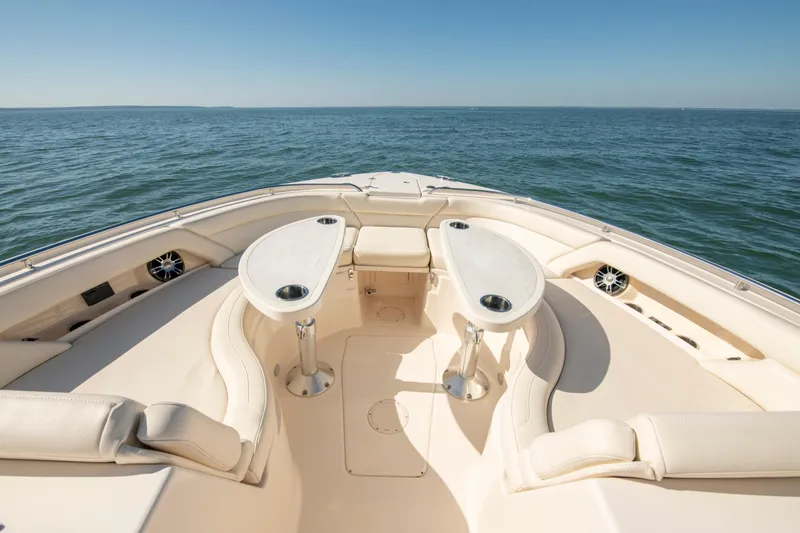 Slide: The Image of Luxurious 2019 Grady-White Freedom 375 boat interior with seating and tables on open water. - 32