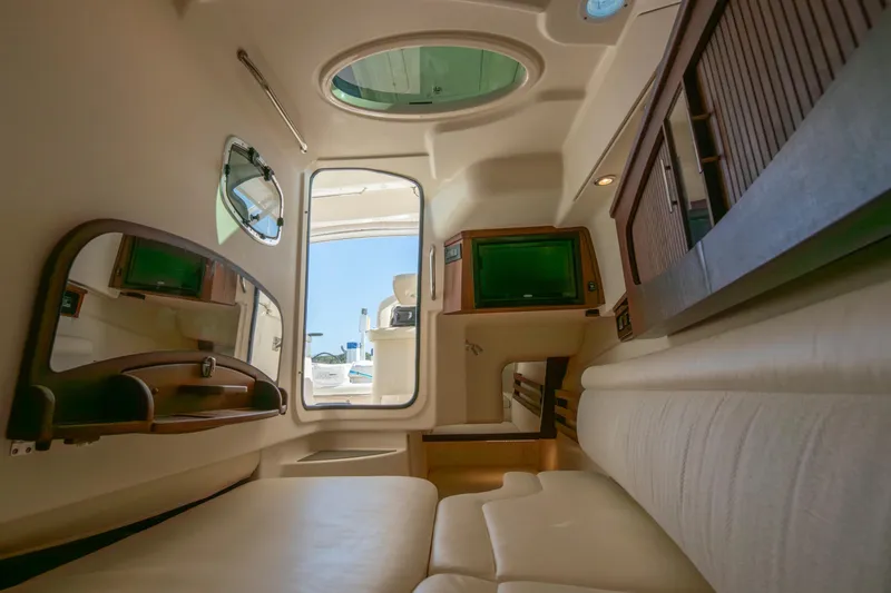 Slide: The Image of Interior of 2019 Grady-White Freedom 375 boat, featuring seating and wooden cabinetry. - 41