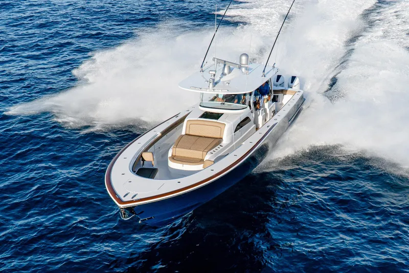 Slide: The Image of 2026 Valhalla Boatworks V-46 cruising swiftly on open ocean waters. - 2