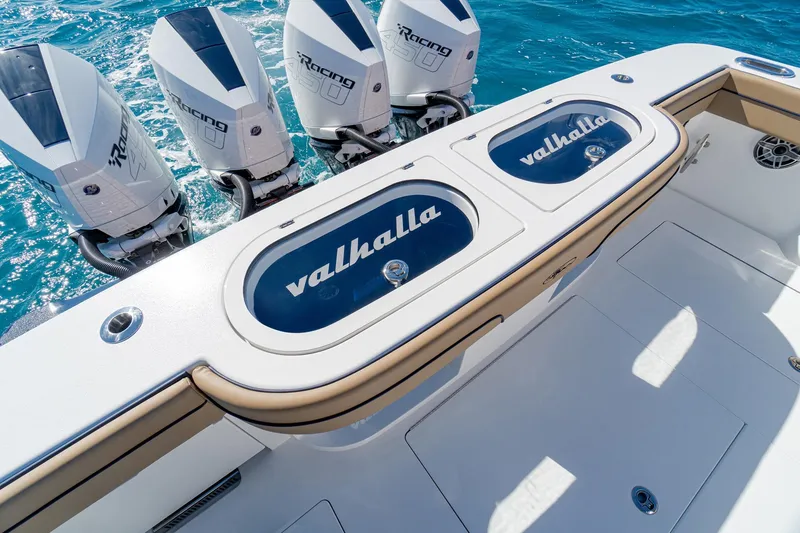Slide: The Image of 2026 Valhalla Boatworks V-46 with powerful outboard engines on blue water. - 22