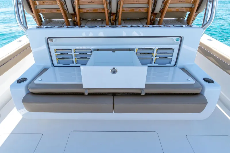 Slide: The Image of 2026 Valhalla Boatworks V-46 fishing station with storage drawers and cushioned seating. - 25
