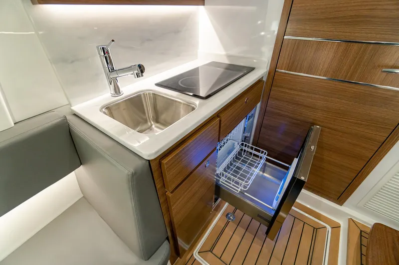 Slide: The Image of Modern kitchen area in 2026 Valhalla Boatworks V-46, featuring sink and drawer dishwasher. - 31