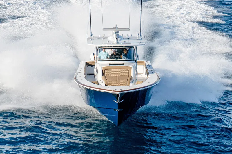 Slide: The Image of 2026 Valhalla Boatworks V-46 cruising on open water, creating dynamic waves. - 4
