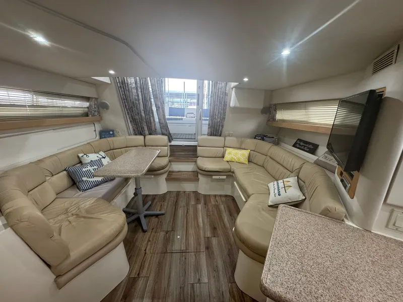 Slide: The Image of Luxurious interior of a 1997 Carver 380 Santego yacht with plush seating and modern decor. - 15