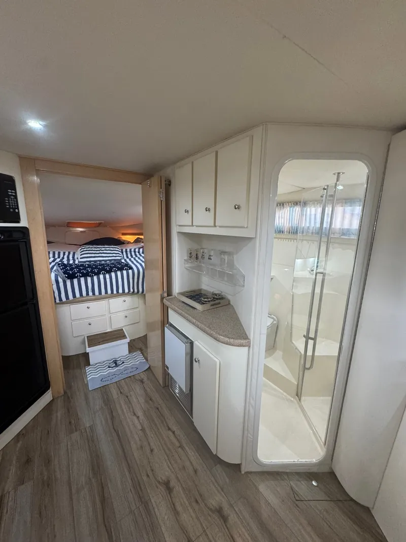 Slide: The Image of Interior of a 1997 Carver 380 Santego yacht with kitchenette and bedroom. - 18