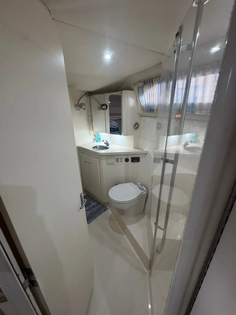 Slide: The Image of Interior of 1997 Carver 380 Santego yacht bathroom with shower and sink. - 19