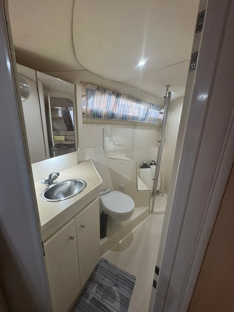 Slide: The Image of Bathroom interior of 1997 Carver 380 Santego yacht with sink, toilet, and shower. - 20