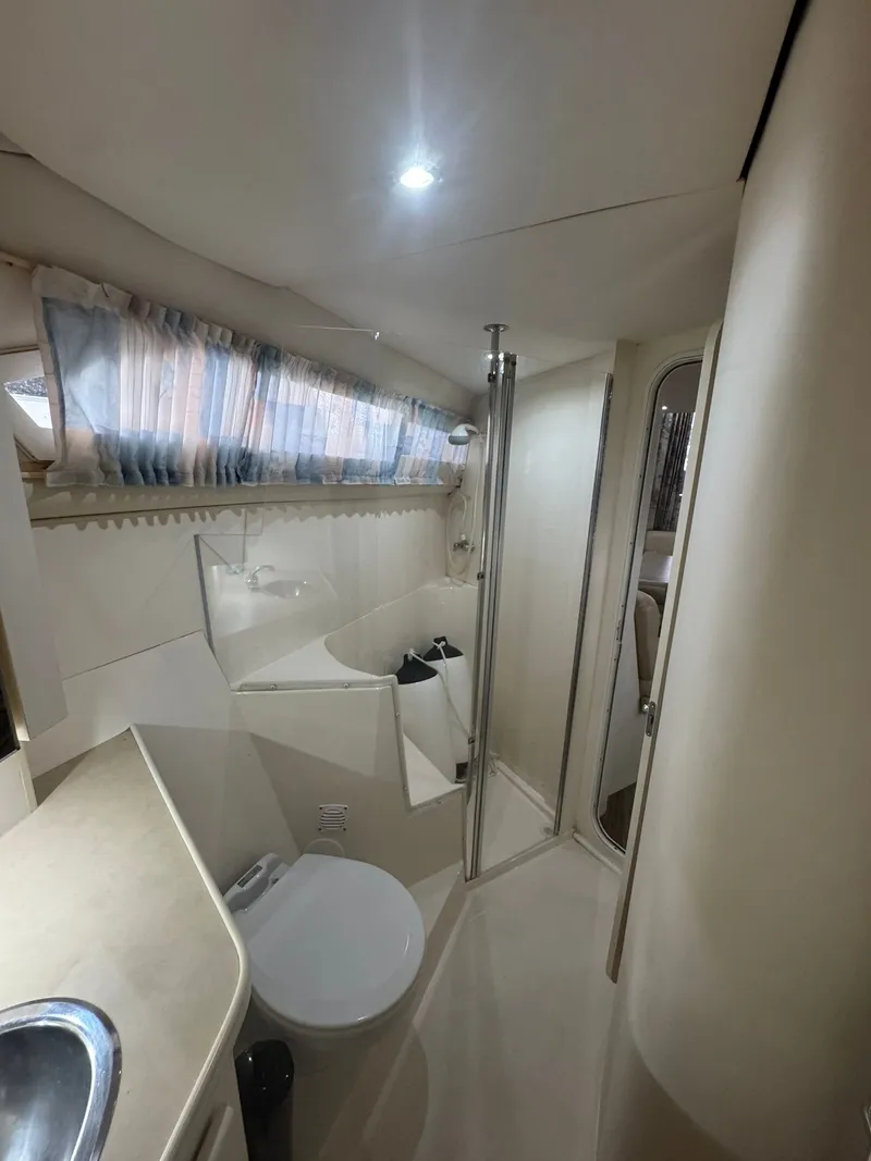 Slide: The Image of Interior of 1997 Carver 380 Santego yacht bathroom with shower and toilet. - 22