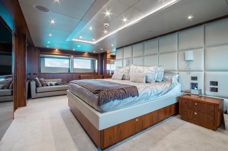 Slide: The Image of Luxurious dining area on 2014 Sunseeker 131 yacht with elegant decor and wood paneling. - 15