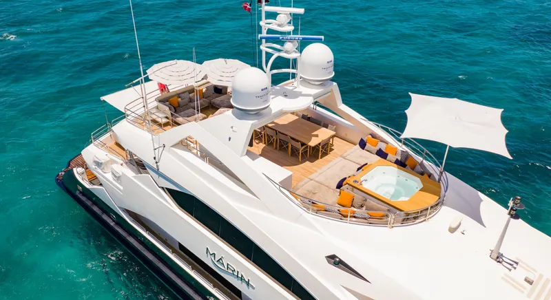 Slide: The Image of Luxurious 2014 Sunseeker 131 yacht on clear blue ocean waters. - 2