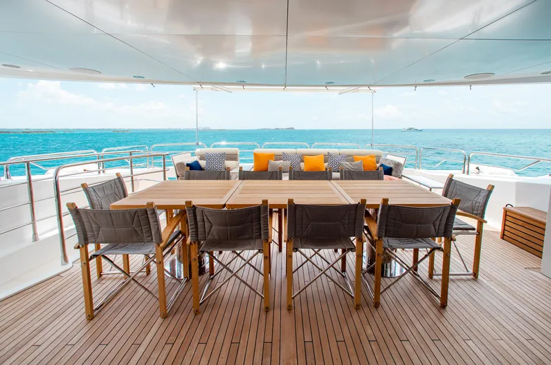 Slide: The Image of Luxurious Sunseeker 131 yacht deck with seating, tables, and ocean view, 2014 model. - 35