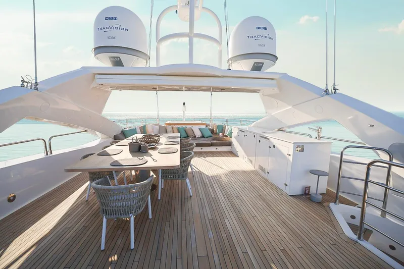Slide: The Image of Luxurious Sunseeker 131 yacht deck with dining area, 2014 model, overlooking serene ocean views. - 47