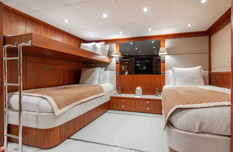 Slide: The Image of Luxurious cabin interior of 2009 Sunseeker 121 yacht with twin beds and modern decor. - 21