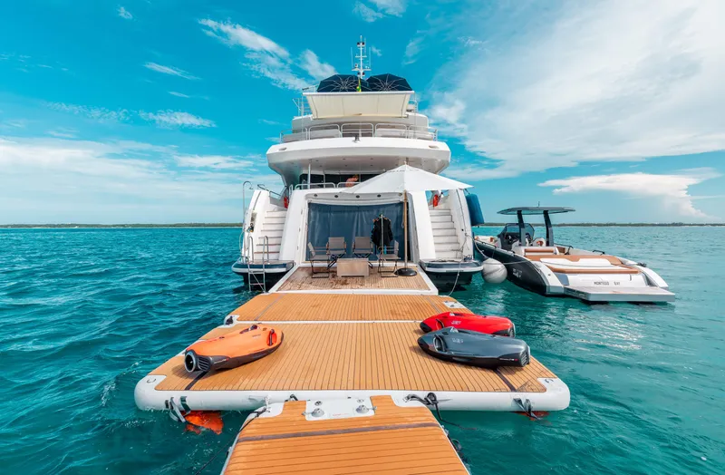 Slide: The Image of Luxury Sunseeker 121 yacht, 2009 model, docked with water toys on a sunny day. - 27