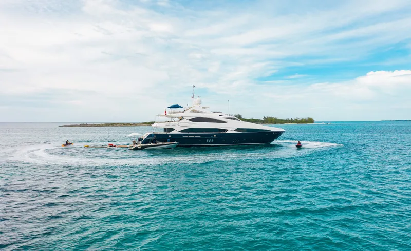 Slide: The Image of Luxury 2009 Sunseeker 121 yacht cruising in clear blue waters. - 28