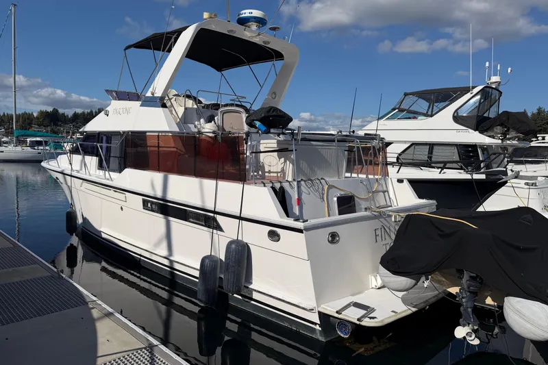Slide: The Image of 1988 Ocean Alexander 42' yacht docked at marina under clear blue sky. - 1