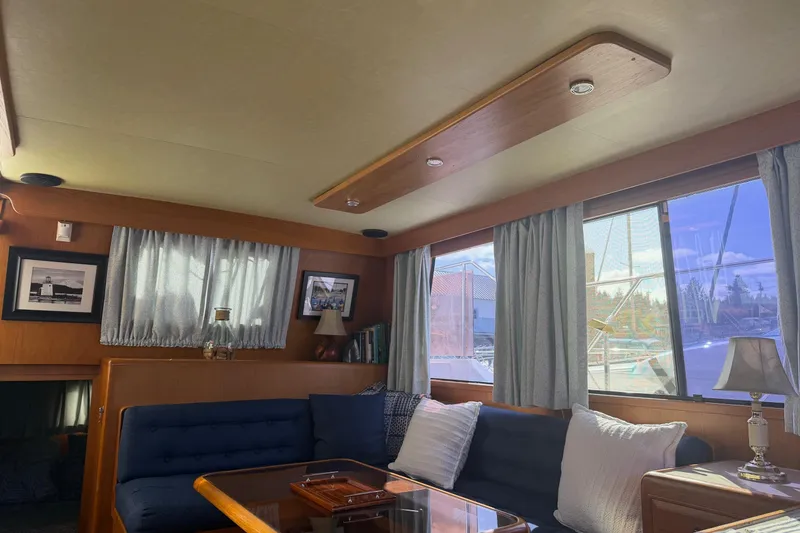 Slide: The Image of 1988 Ocean Alexander 42' yacht helm with wooden wheel and navigation instruments. - 20