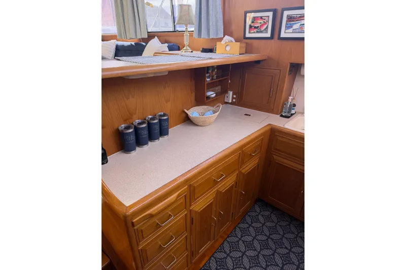 Slide: The Image of Interior of 1988 Ocean Alexander 42' yacht with cozy seating and wooden accents. - 22
