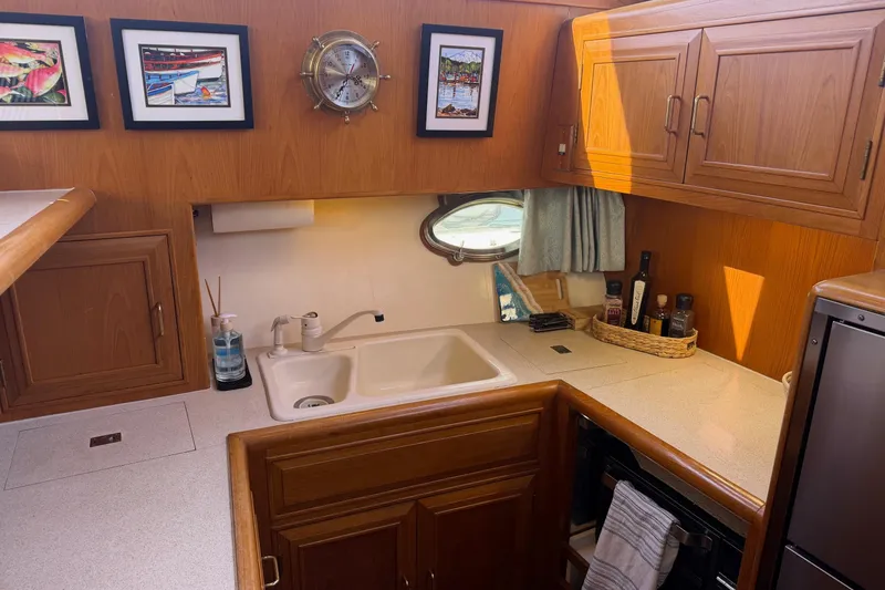 Slide: The Image of Interior of 1988 Ocean Alexander 42' yacht with cozy seating and elegant decor. - 24