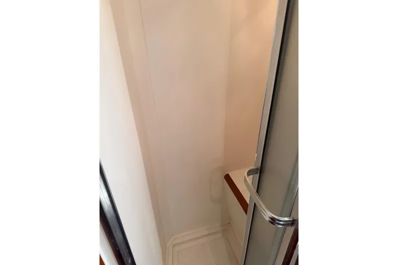 Slide: The Image of Bathroom interior of 1988 Ocean Alexander 42' yacht with wooden cabinetry and porthole windows. - 35