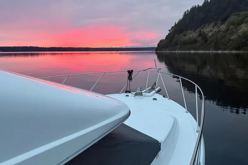 Slide: The Image of Ocean Alexander 42' yacht at sunset on calm waters, 1988 model. - 4