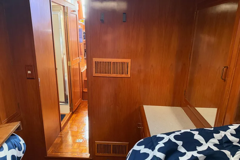 Slide: The Image of Shower area in 1988 Ocean Alexander 42' yacht, featuring glass door and wooden accents. - 40