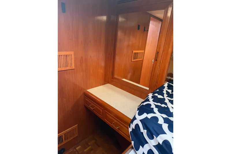 Slide: The Image of Interior of 1988 Ocean Alexander 42' yacht with wooden paneling and cozy cabin space. - 45