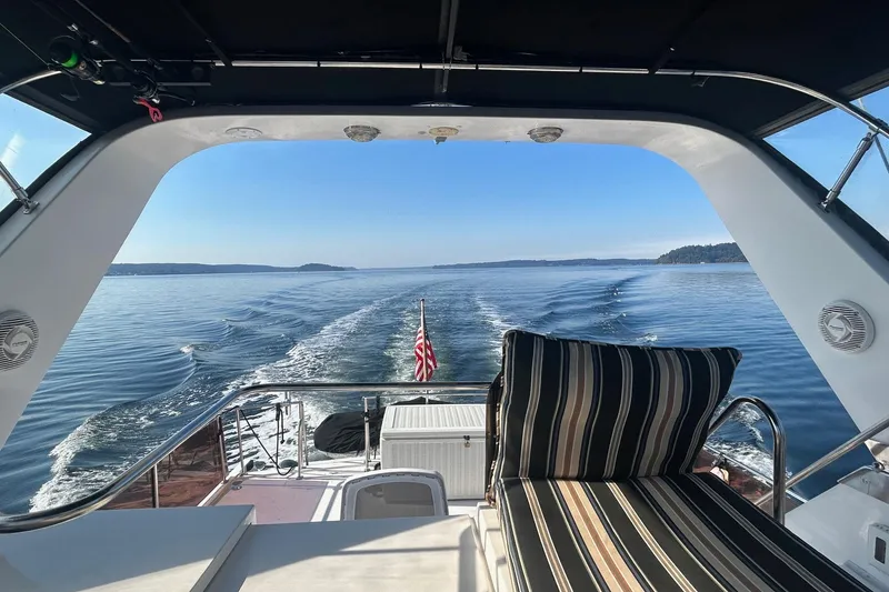 Slide: The Image of 1988 Ocean Alexander 42' yacht docked at marina, surrounded by other boats. - 5