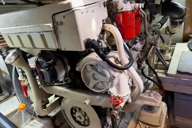 Slide: The Image of Engine of a 1988 Ocean Alexander 42' yacht, showcasing mechanical components. - 53