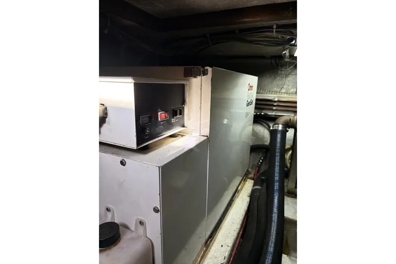 Slide: The Image of Engine room of 1988 Ocean Alexander 42' yacht with generator and wiring. - 56