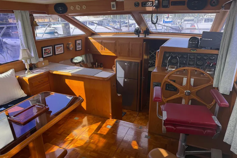 Slide: The Image of Ocean Alexander 42' yacht cruising on calm waters, 1988 model, with scenic ocean view. - 13