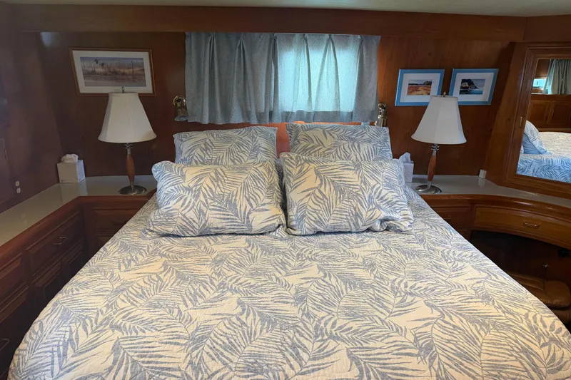Slide: The Image of 1988 Ocean Alexander 42' yacht bathroom with sink, shower, and wooden cabinetry. - 37