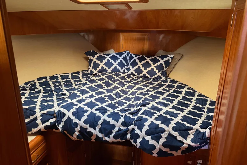 Slide: The Image of Interior view of 1988 Ocean Alexander 42' yacht with wooden finishes and seating area. - 41