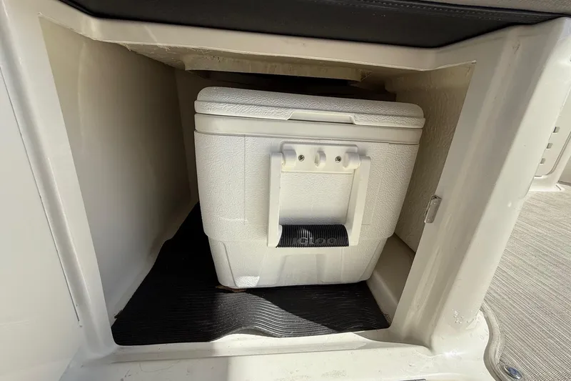 Slide: The Image of 2021 Sea Ray SLX 310 boat with open cooler and sink on deck. - 16