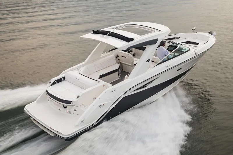 Slide: The Image of 2021 Sea Ray SLX 310 boat interior with spacious seating and elegant design. - 2