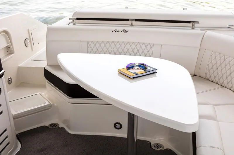 Slide: The Image of 2021 Sea Ray SLX 310 boat interior with luxurious seating and sleek design. - 8