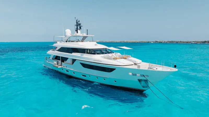 The Image of Luxury yacht Sanlorenzo SD126 2016 cruising with jet skis in turquoise waters. - 0