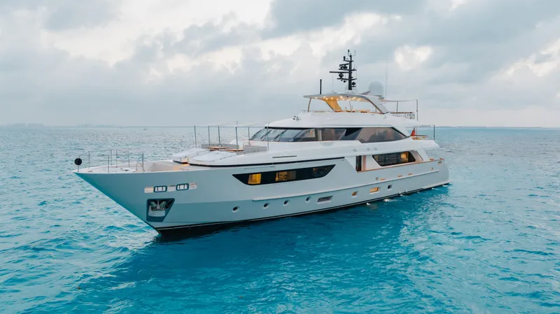 Slide: The Image of Sanlorenzo SD126 2016 yacht cruising on calm blue waters under a cloudy sky. - 2