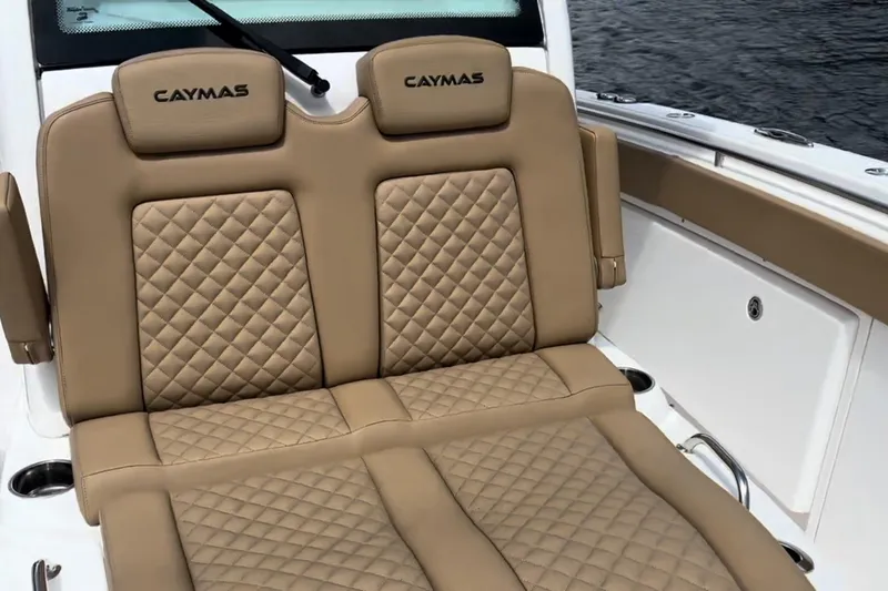 Slide: The Image of 2023 Caymas 341 CC boat with luxurious tan quilted seating. - 14