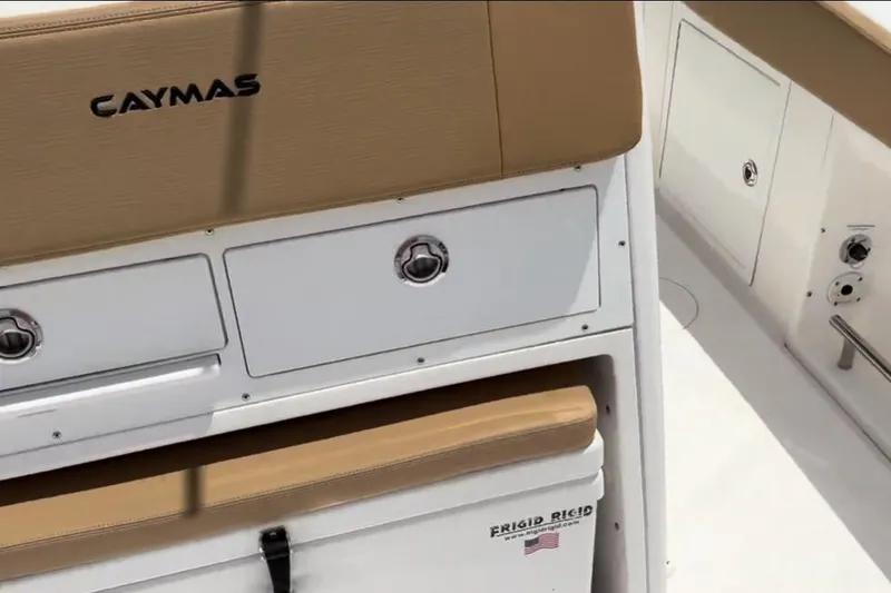 Slide: The Image of 2023 Caymas 341 CC boat interior with storage compartments and seating. - 32