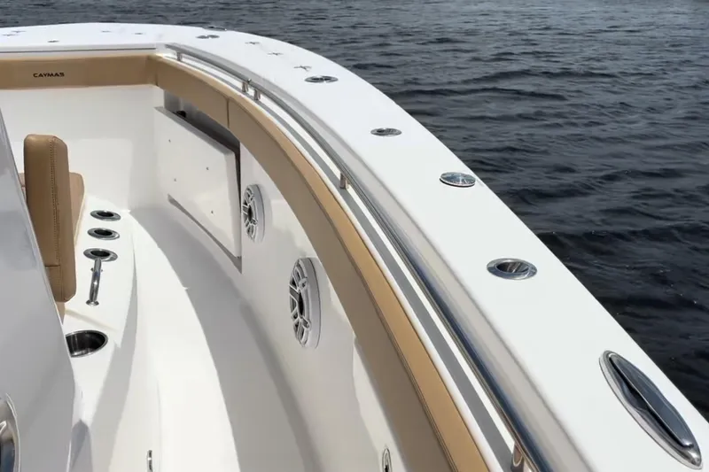 Slide: The Image of 2023 Caymas 341 CC boat interior with sleek design and ocean backdrop. - 9