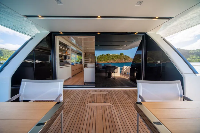 Slide: The Image of Sanlorenzo SL86 2018 yacht interior with open deck and scenic ocean view. - 13