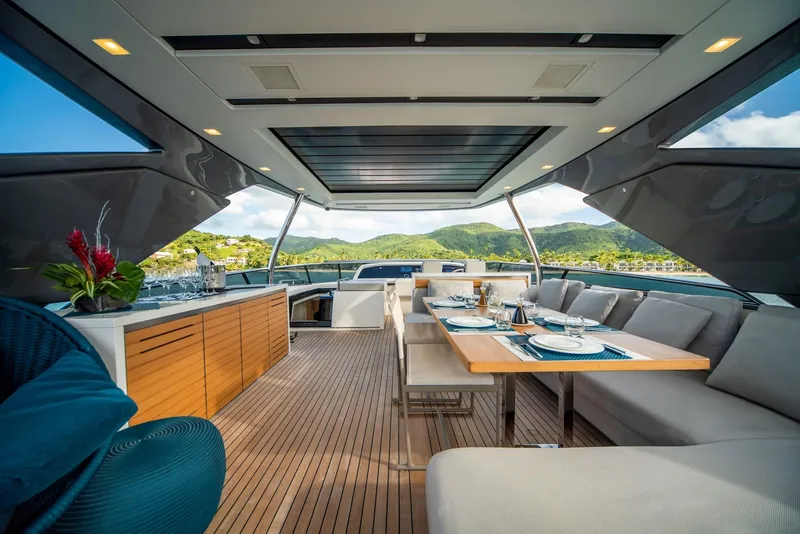 Slide: The Image of Luxurious 2018 Sanlorenzo SL86 yacht interior with elegant dining area and scenic views. - 17