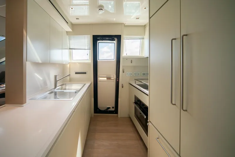 Slide: The Image of Modern kitchen interior of 2018 Sanlorenzo SL86 yacht, featuring sleek cabinetry and appliances. - 39