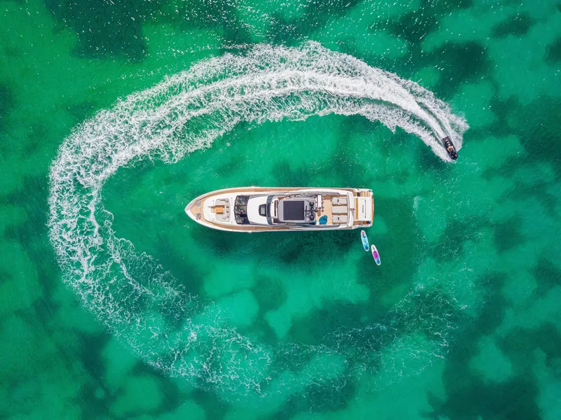 Slide: The Image of Aerial view of 2018 Sanlorenzo SL86 yacht in turquoise water with jet ski circling. - 6