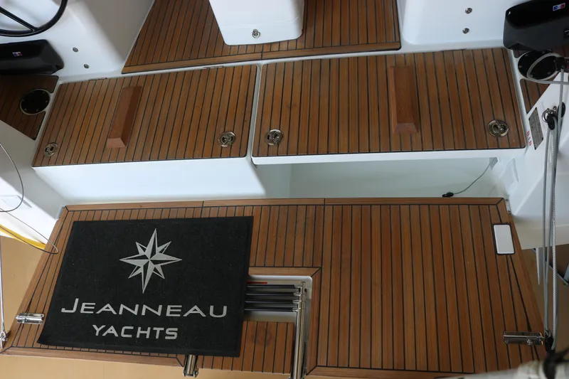 Slide: The Image of Teak deck of 2026 Jeanneau Sun Odyssey 415 yacht with branded mat. - 25