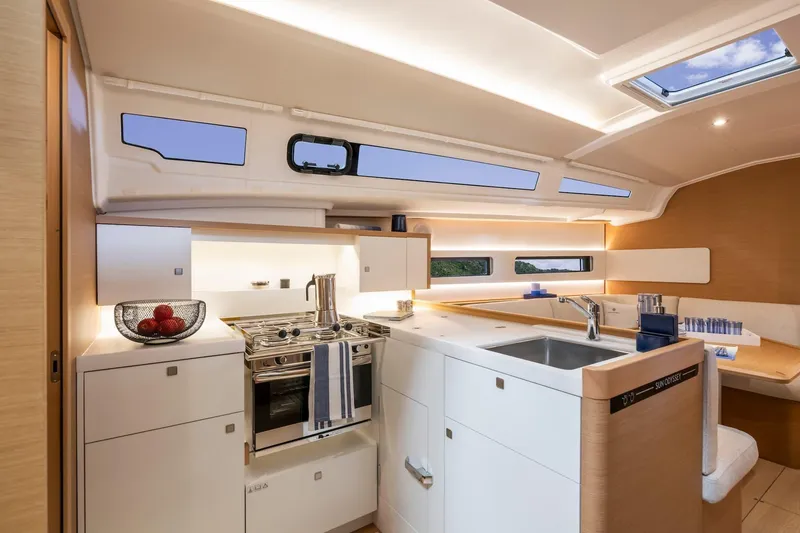 Slide: The Image of Modern kitchen interior of 2026 Jeanneau Sun Odyssey 415 yacht, featuring sleek design and amenities. - 15
