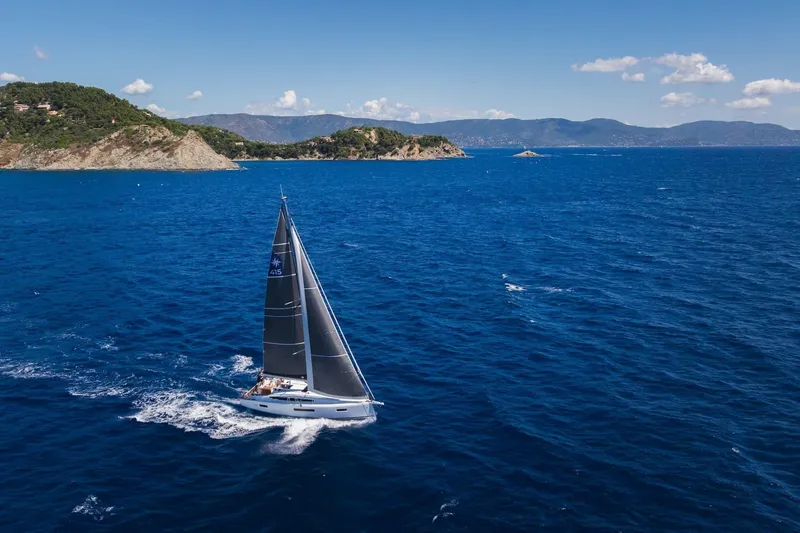 Slide: The Image of Sailing yacht Jeanneau Sun Odyssey 415, 2026 model, cruising in open blue sea. - 3